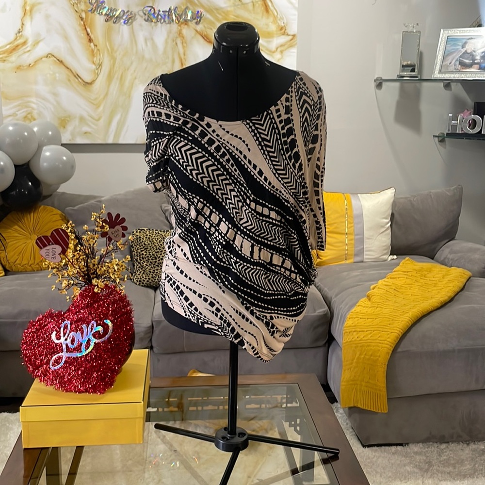 Bebe slouch asymmetric top. Can be worn differently. Size medium